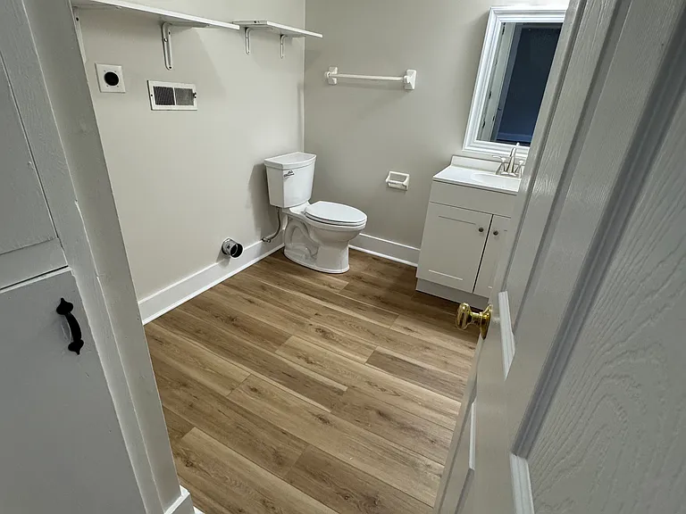 Newly remodeled half bathroom with washer/dryer hookup