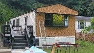 old wall sheeting removed new sheeting being installed 