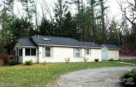 Neat and well cared for with circle driveway and close to Bass Lake for fishing and sailing
