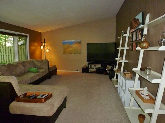 Family room has vaulted ceilings and lot of windows that let in a lot of natural lighting!