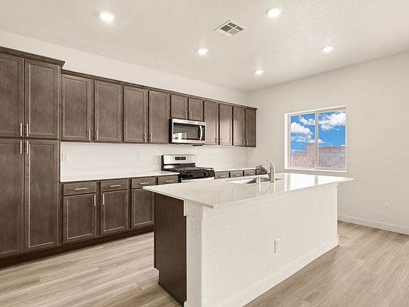 Each kitchen features upgraded, stainless steel appliances.