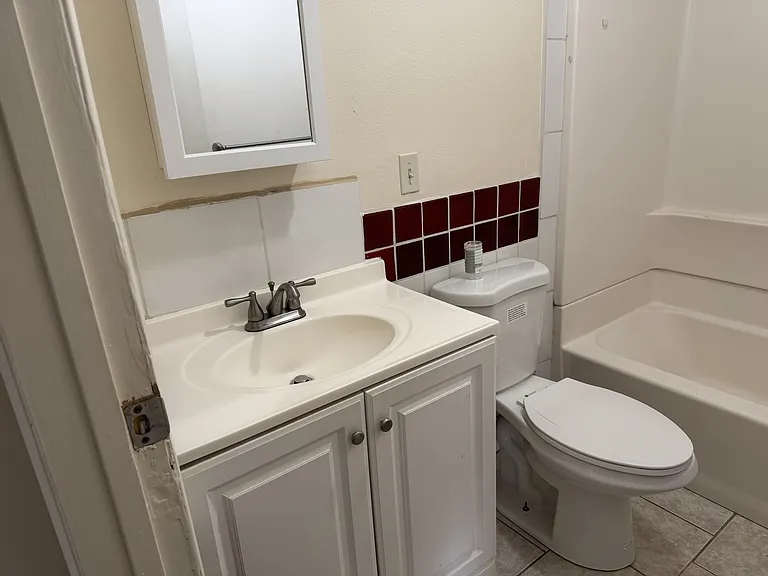 Full bathroom with tub