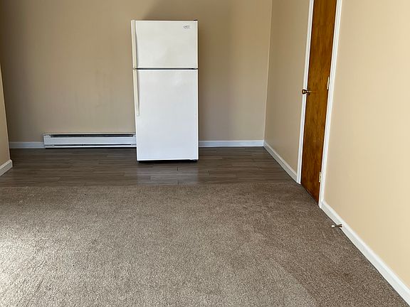 Living room flowing into kitchen area