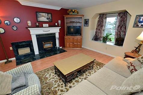 Come up the stairs and relax in the Living Room with natural fireplace