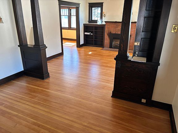 Dining room, living room and fireplace, southern exposure den in the back