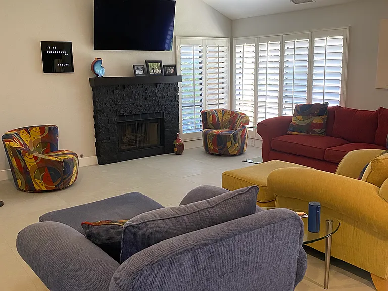 Vaulted ceiling great room with gas fireplace and large wall mount smart tv. Seating for 7 easily,