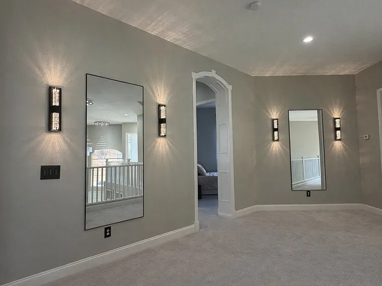 Spacious upper-level loft area at the top of the stairs.