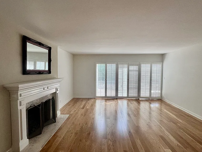 Living Room with Fireplace and Sliding Door to Backyard.
