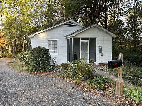 Screened porch entrance to home from driveway