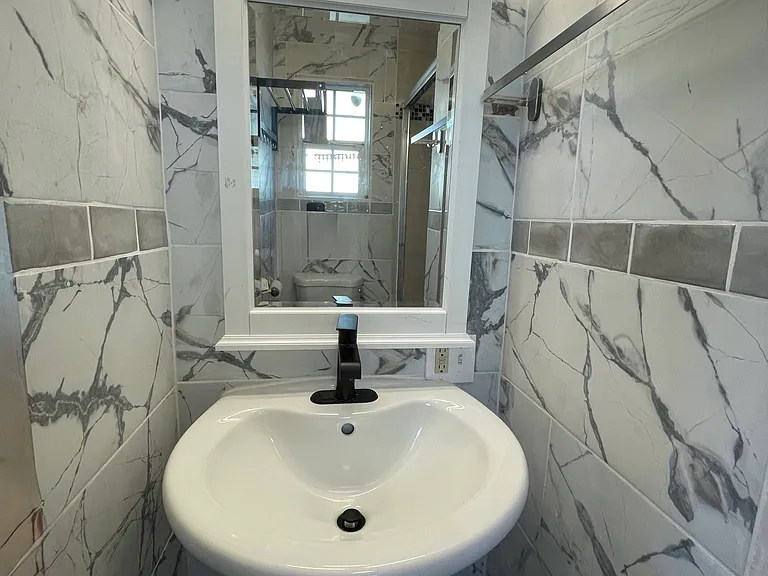 Master bathroom pedestal sink.