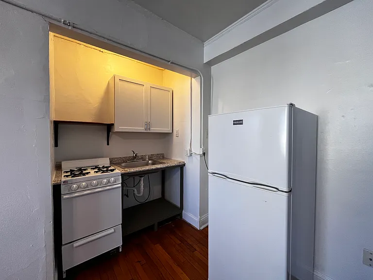 A cozy kitchen nook that maximizes functionality while preserving the apartment's spacious feel.