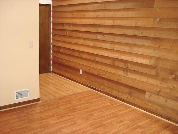 Entry way with panelled cedar wall.