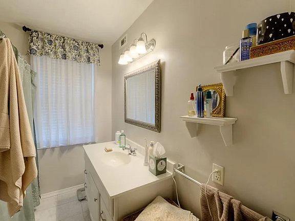Updated bathroom with bath tub