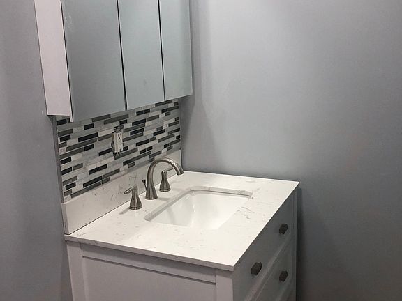 Marble vanity and tile back splash