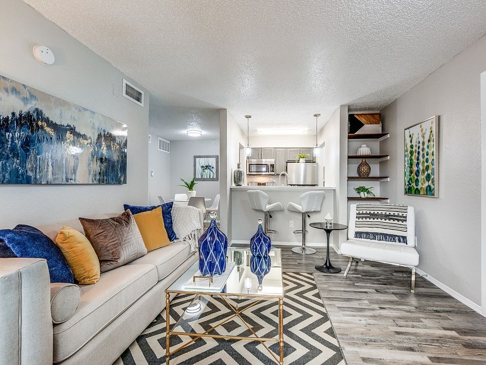 Bright and spacious living area with modern finishes and large windows for natural light.