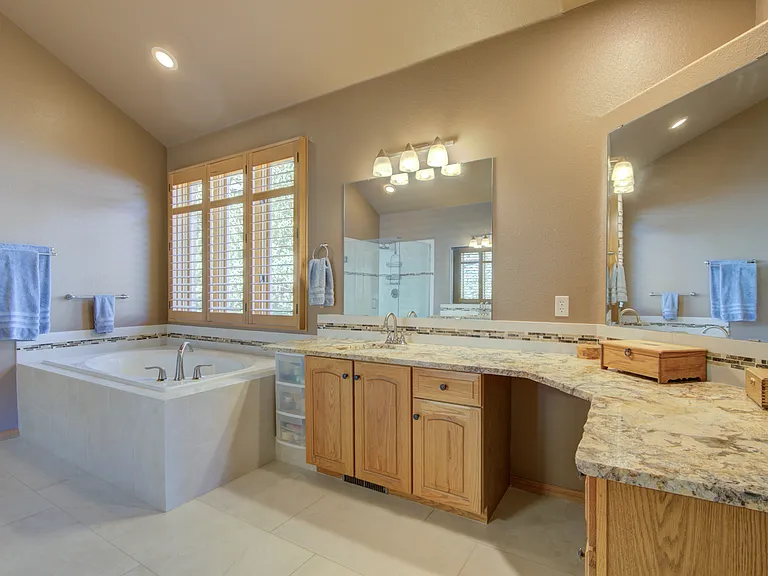 Vanity area with space for a chair.