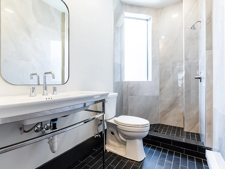 Very cool bathroom! European frameless shower enclosure.