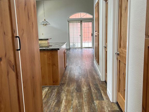 Hallway view from bedrooms to Kitchen and Living room area.