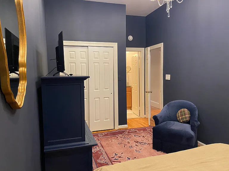 bedroom #2 has in-suite bath and comfy chair