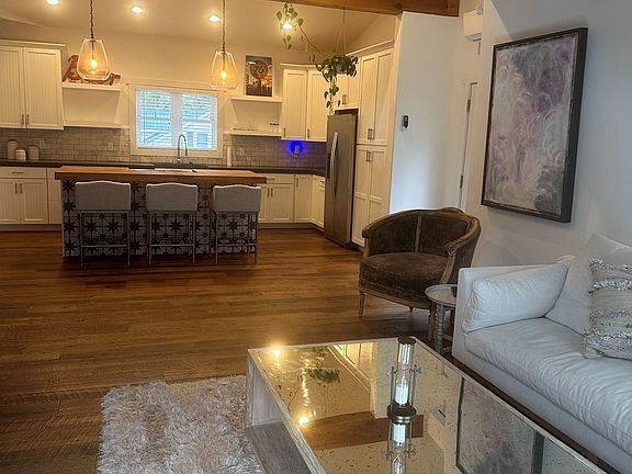 Living room with Kitchen in background