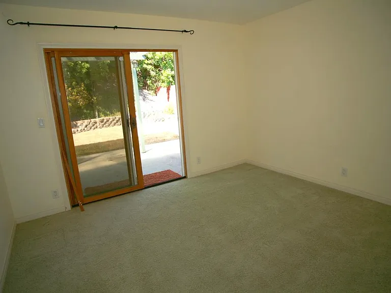 Bedroom with slider to outside