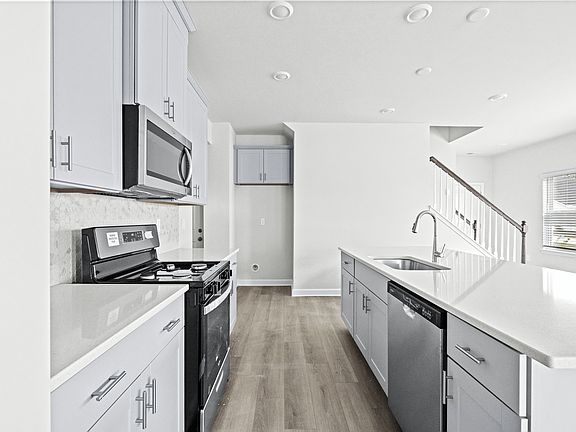 The well 8212 appointed kitchen features plenty of counter space to make meal prep a breeze.