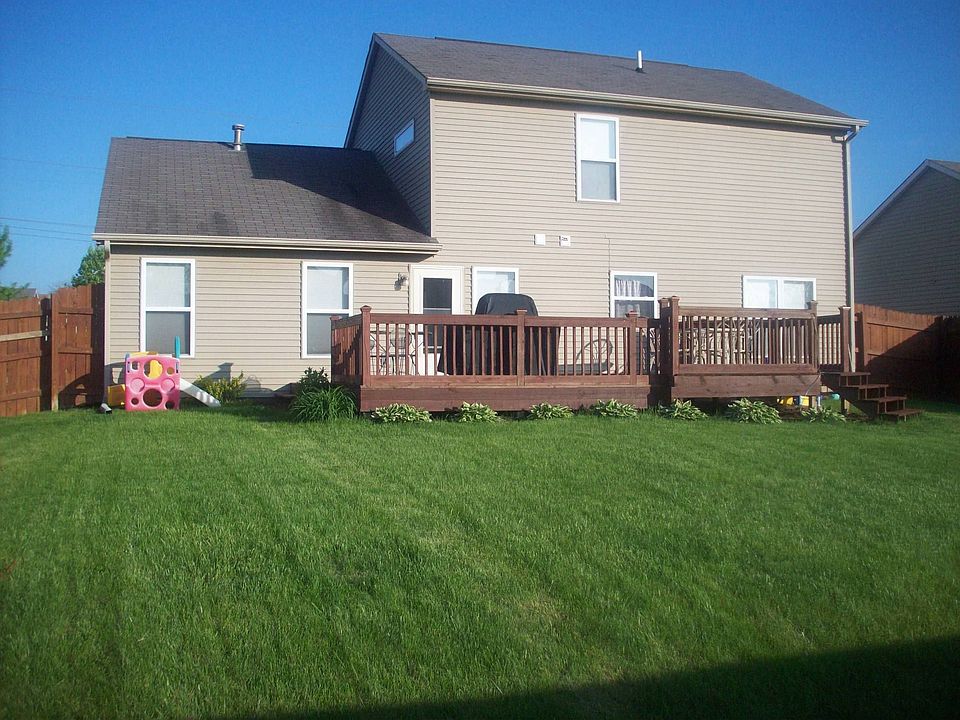Multi-level deck, privacy fence, weeping chery and blossoming crapapple trees