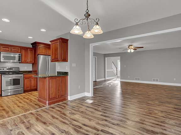 Kitchen, Dining and Living Rooms
*Note that appliances are black in this unit.