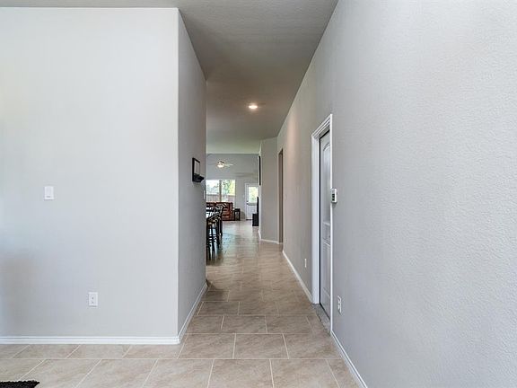Upon entry, you will notice the oversized ceramic tile flooring that flows throughout the main living spaces, and is so easy to maintain.