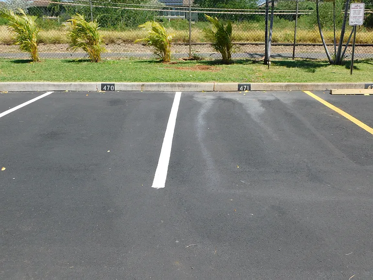 Second assigned, uncovered parking stall.