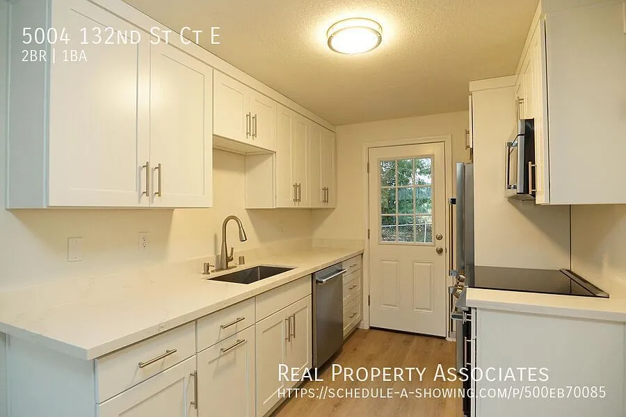 Newly Renovated Two Bedroom Duplex Home with an Attached One Car Garage — Photo 2