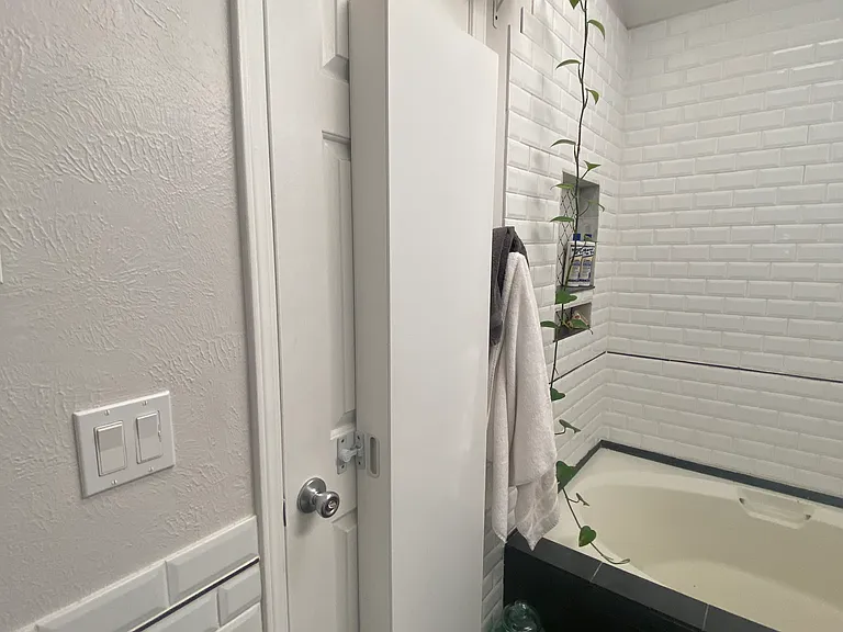 Door storage unit holds about 3 medicine cabinets worth of your stuff in addition to the under sink storage and upper wall-mounted shelf.