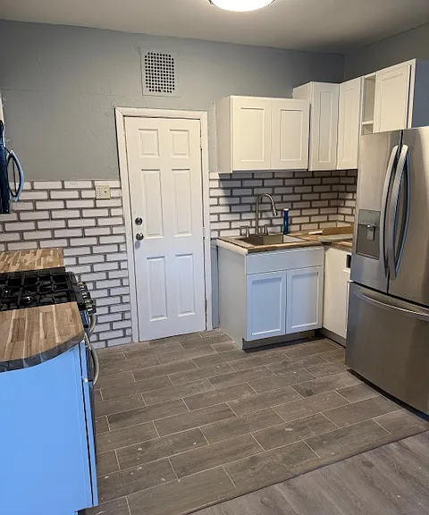 Kitchen area,door leading to basement