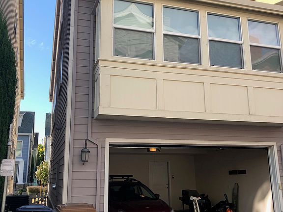 Back of the house. 2 car garage with EV charger