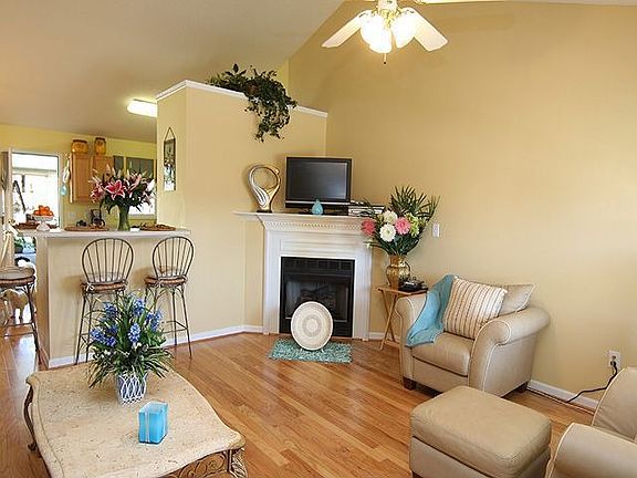 Corner Fireplace and view of raised breakfast bar