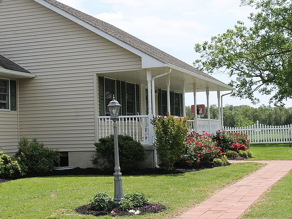Sidewalk to front door
						:
						Vinyl fencing in front of and around property on 2 sides.