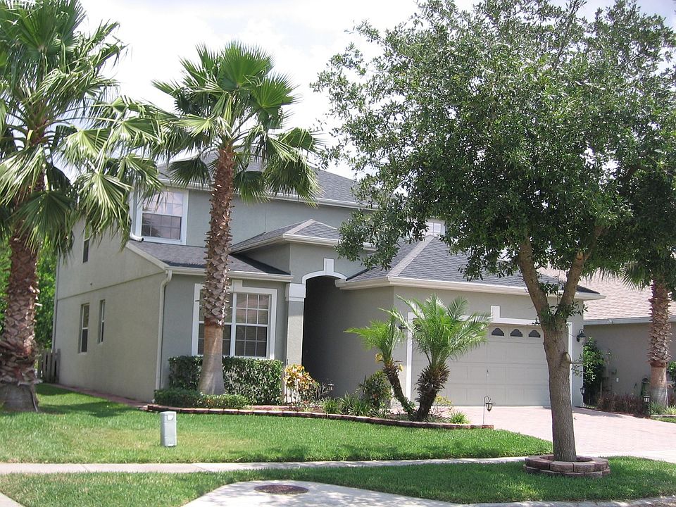 Well-maintained landscaping and brick pavers make a great first impression.