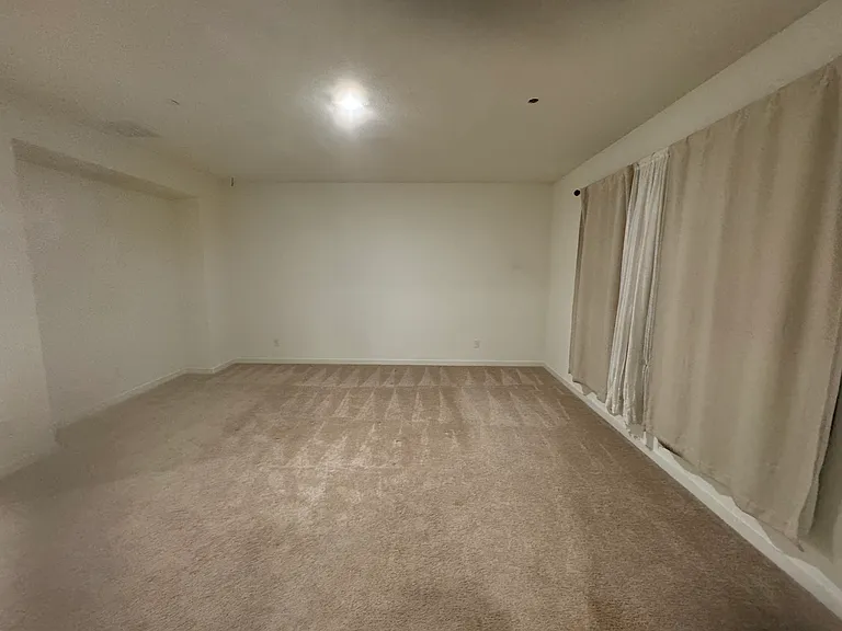 Master bedroom with curtains view