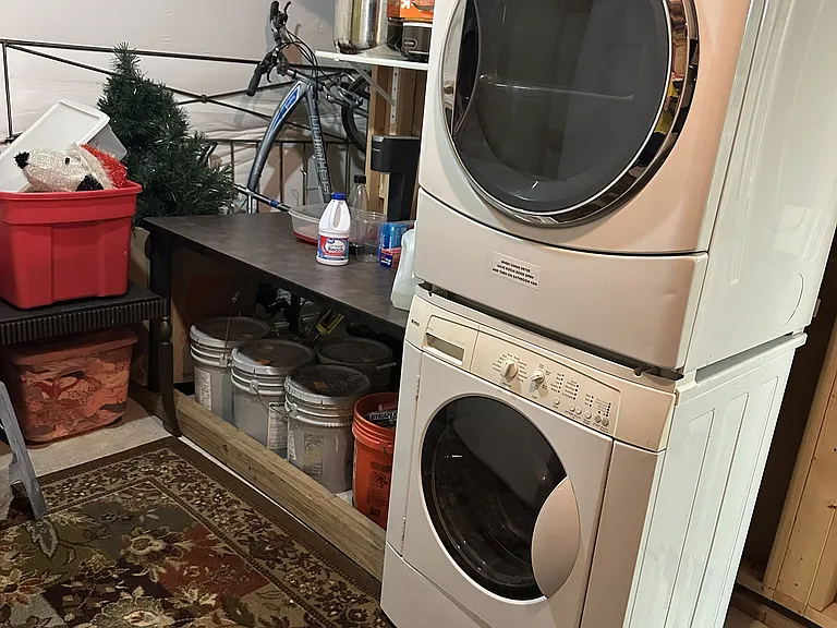 Laundry area in Basement Storage Room (sole access)