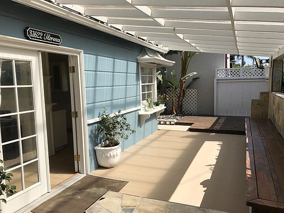 Covered sundeck runs entire front of house