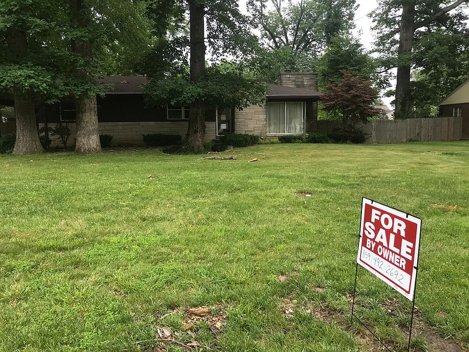 Front of house with sign