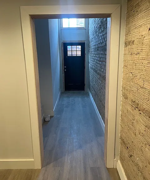 Exposed brick and secure entryway.