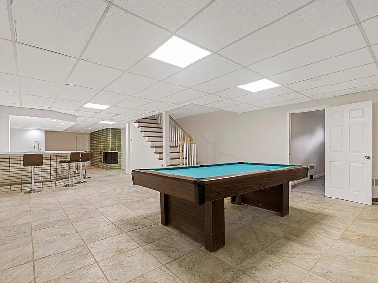 large finished basement with wet bar