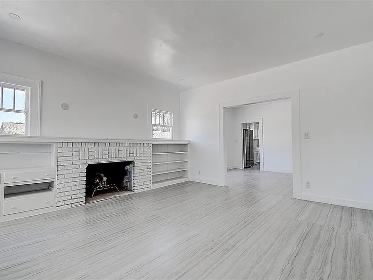 nside, fresh finishes and tile flooring flow through bright living spaces, anchored by a cozy fireplace _ ideal for relaxing evenings.