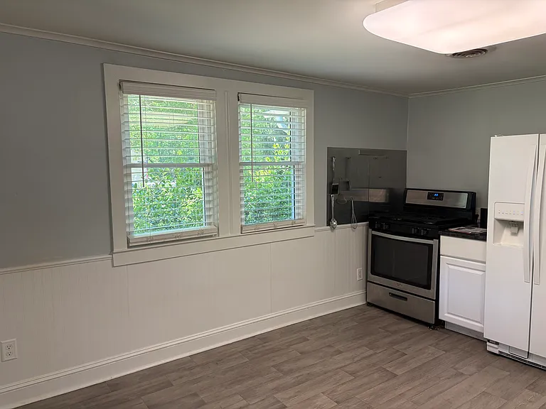 Double window provides abundant sunlight for eat in kitchen.