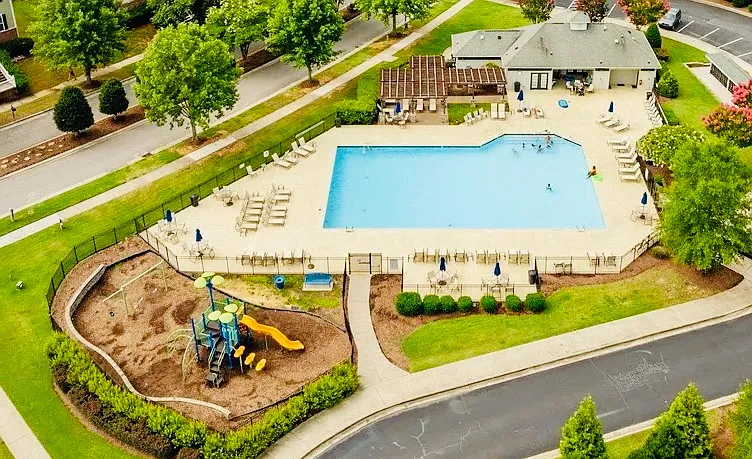 Enjoy seating under the pergola, swimming in the pool, or playing on the playground.
