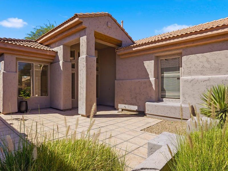 Front of home with courtyard.