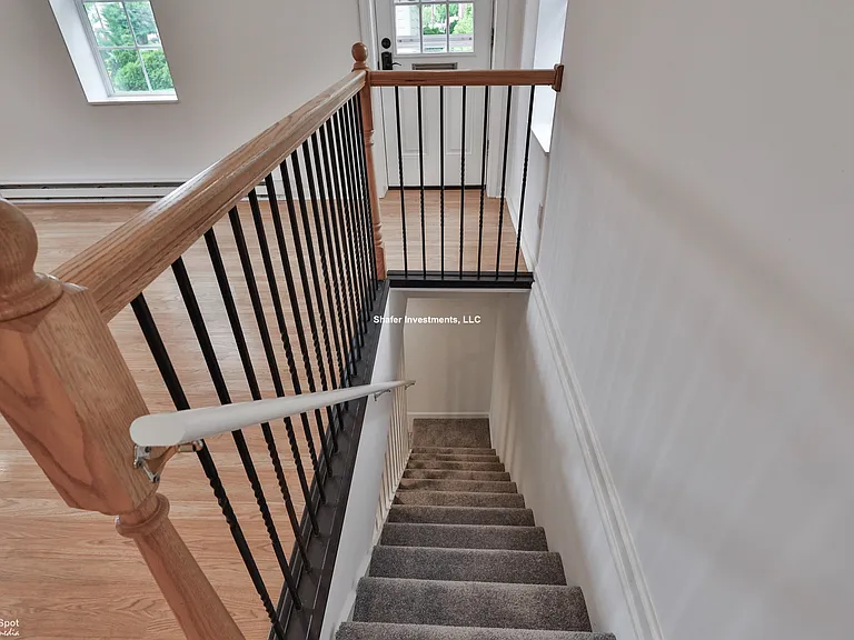 View of the great room and stairs to the basement