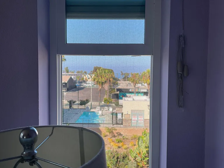 view of pool, jacuzzi spa and ocean from 3rd floor master bedroom