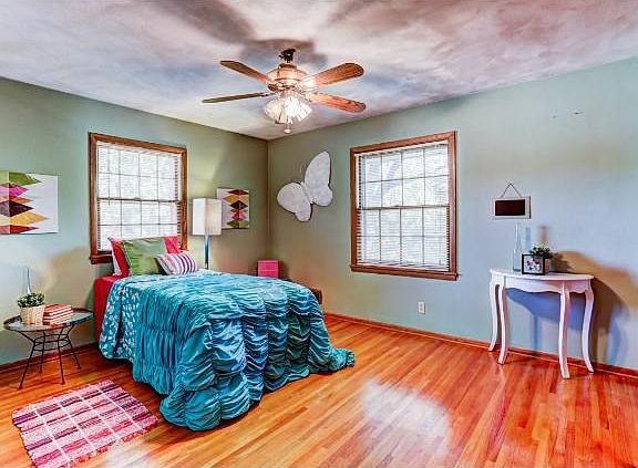 One of the 3 upper level bedrooms. 2 of these rooms have the original hardwood floors!